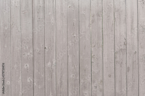 abstract background of an old painted wooden fence close up