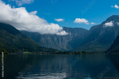 The beautiful Hallstätter See on a sunny autumn day with blue sky and clouds