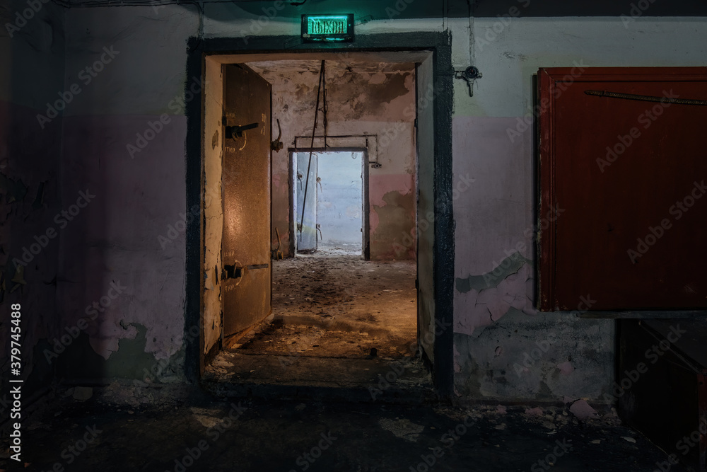 Opened heavy steel armored hermetic door in the Soviet bomb shelter Opened heavy steel armored hermetic door in the Soviet bomb shelter