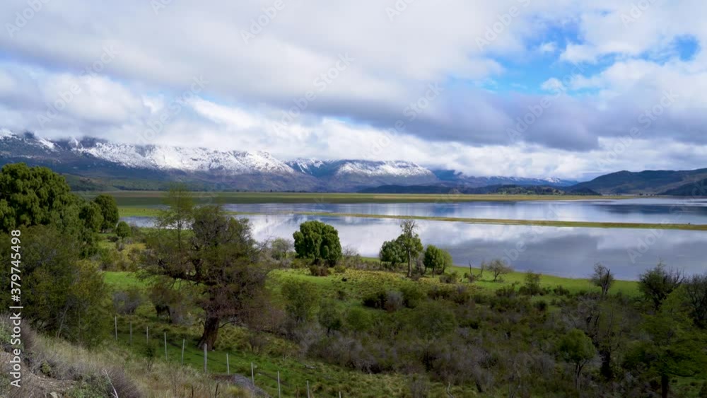 Dramatic clouds over Laguna Terraplen and the snow capped mountains of Los Alerces National Park, Argentina Dramatic clouds over Laguna Terraplen and the snow capped mountains of Los Alerces National Park, Argentina