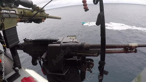 2020 Helicopter interdiction tactical squadron attached to the Coast Guard fires warning shots across the bow of a drug smuggler.