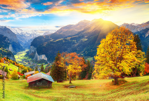 Fabulous autumn view of picturesque alpine Wengen village and Lauterbrunnen Valley