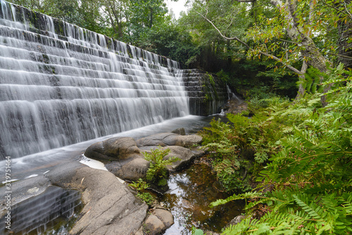 Fototapeta Naklejka Na Ścianę i Meble -  walk of lovers waterfall in lugo Galicia
