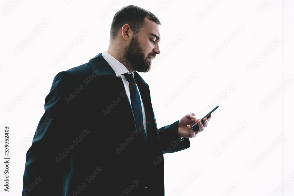 Busy successful man using smartphone on white background Busy successful man using smartphone on white background