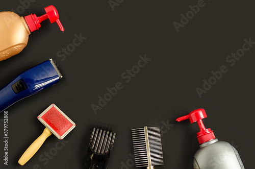 Obraz na plátně top view, flat lay on tools and products for dog grooming, combing, washing pet on dark background, copy space, place for text