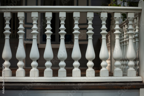 Balusters in the decoration of the veranda railings. 