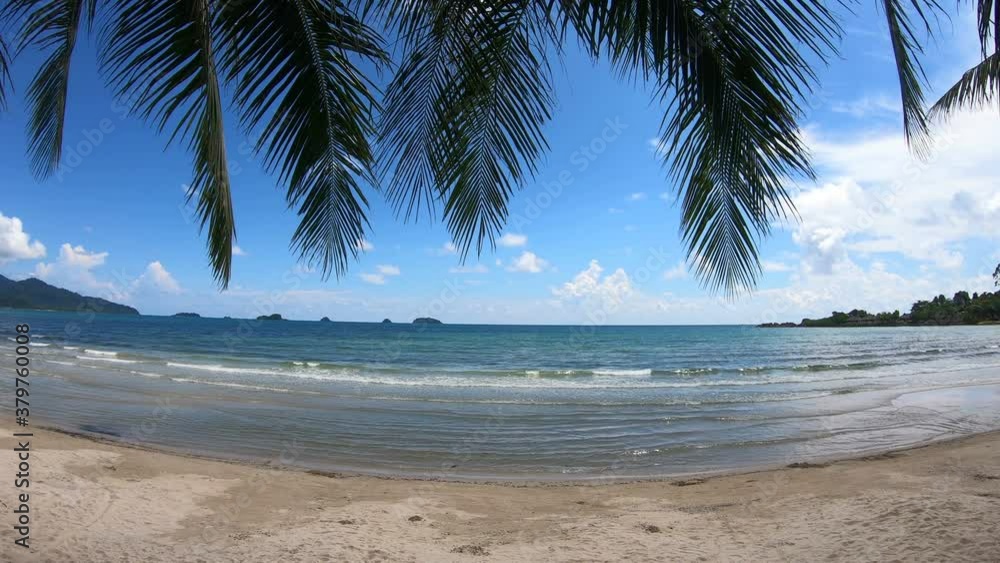 Clear sea and white sand beach with coconut trees and sky as background at Koh Chang, Trat, Thailand. Clear sea and white sand beach with coconut trees and sky as background at Koh Chang, Trat, Thailand.