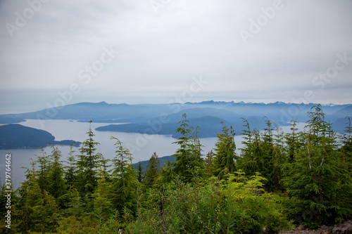 Bowen Island lookout on a dreary, cloudy, foggy day from a view point on Cypress Mountain in British Columbia, Canada with the mountains, ocean and coastal islands in the backrgound