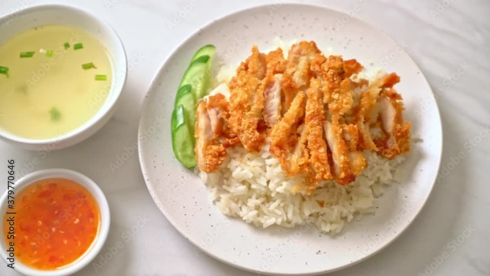 Hainanese chicken rice with fried chicken or rice steamed chicken soup with fried chicken - Asian food style Hainanese chicken rice with fried chicken or rice steamed chicken soup with fried chicken - Asian food style
