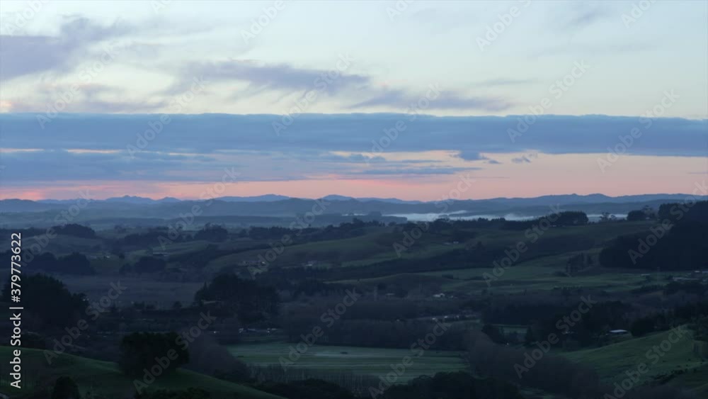 sun setting over the countryside in Pokeno, New Zealand sun setting over the countryside in Pokeno, New Zealand