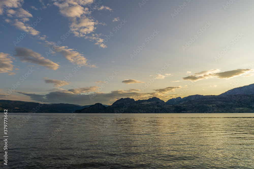 cloudy sky seen from the shore of Okanagan lake at morning British Columbia Canada