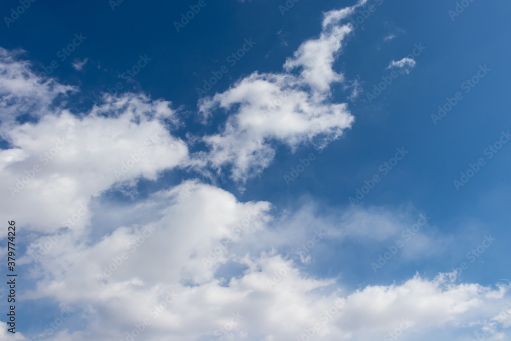 Fototapeta premium Bright blue sky and fluffy white clouds, wallpaper