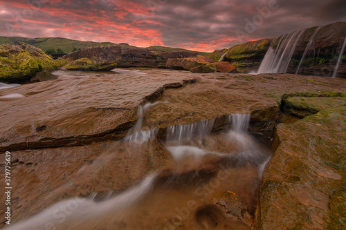 Colourful Sunset near Water stream at Karmih Varieties Spot near Cherrapunji  Meghalaya India