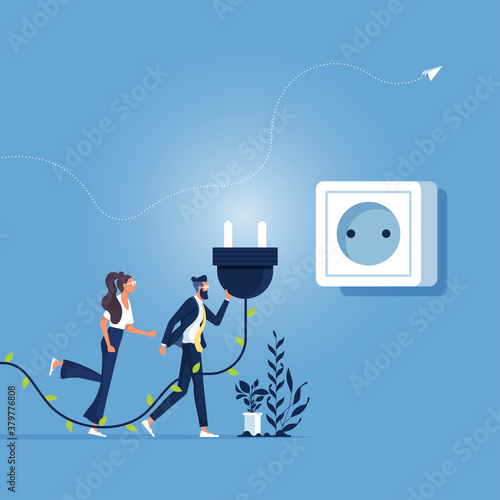 Power saving sustainable development green concept, Business people holding Electric green power plug  in hand, plugged in wall socket, Connecting green power plug