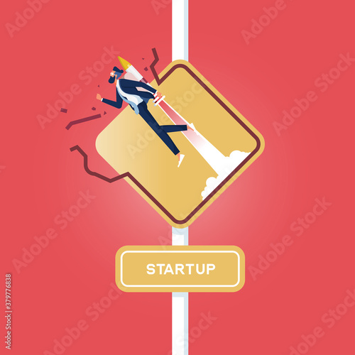 Sign of entrepreneur launching-Business startup concept, Sign of entrepreneur launching, Startup wording on road sign, Businessman with rocket breakthrough the road sign