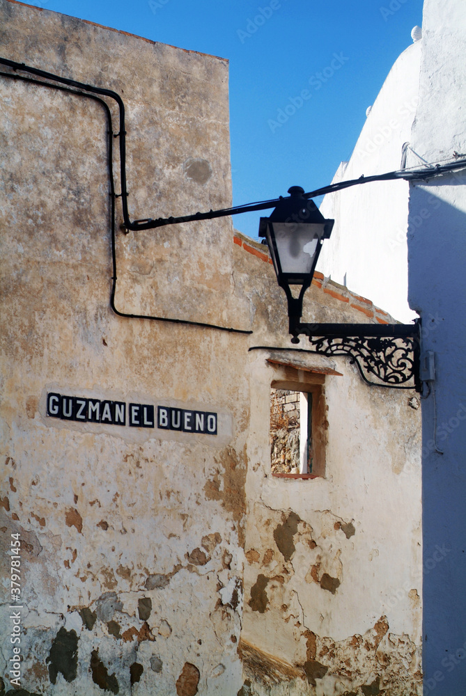 old facade with candelabra in little spanish village old facade with candelabra in little spanish village