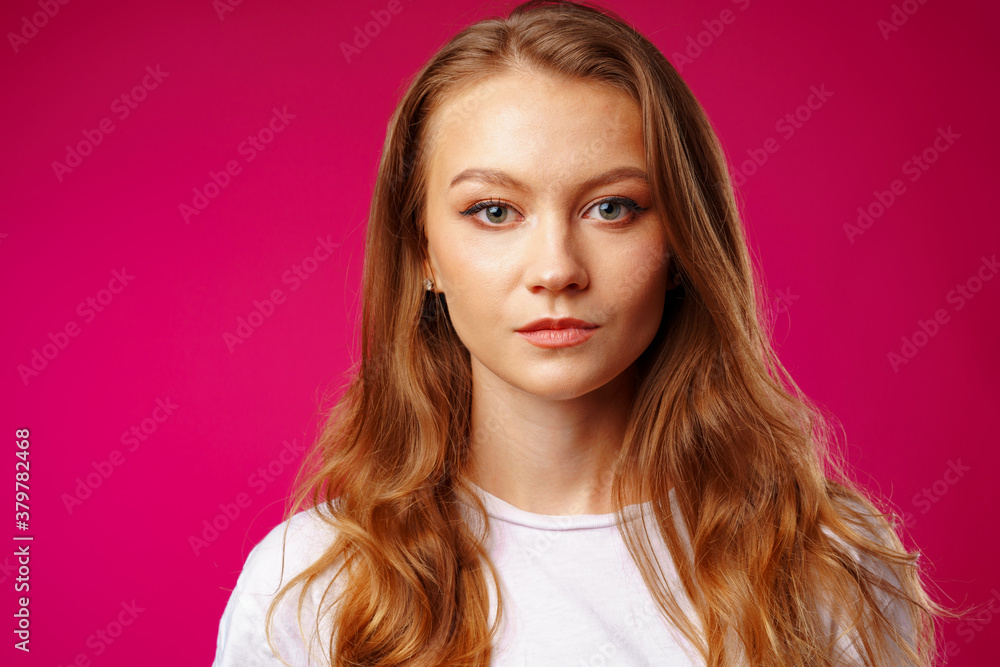Serious young beautiful woman portrait looking at camera Serious young beautiful woman portrait looking at camera