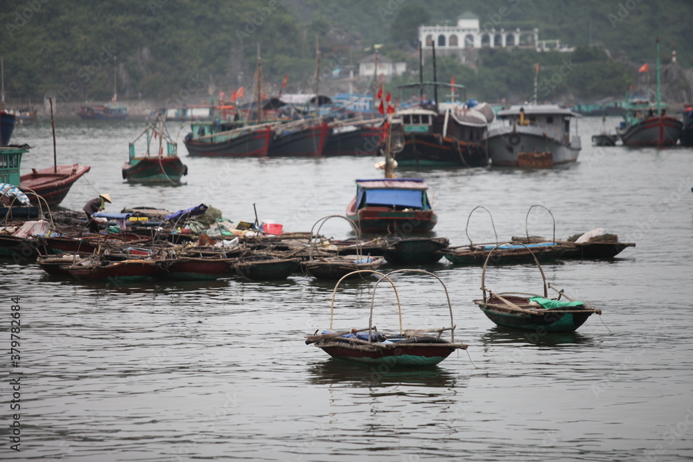 Floating Fishing Village In The Ha Long Bay. Cat Ba Island, Vietnam Asia. Cat Ba, Vietnam - March 5, 2020 Floating Fishing Village In The Ha Long Bay. Cat Ba Island, Vietnam Asia. Cat Ba, Vietnam - March 5, 2020