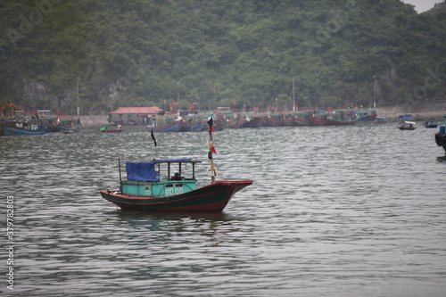 Fototapeta Naklejka Na Ścianę i Meble -  Floating Fishing Village In The Ha Long Bay. Cat Ba Island, Vietnam Asia. Cat Ba, Vietnam - March 5, 2020