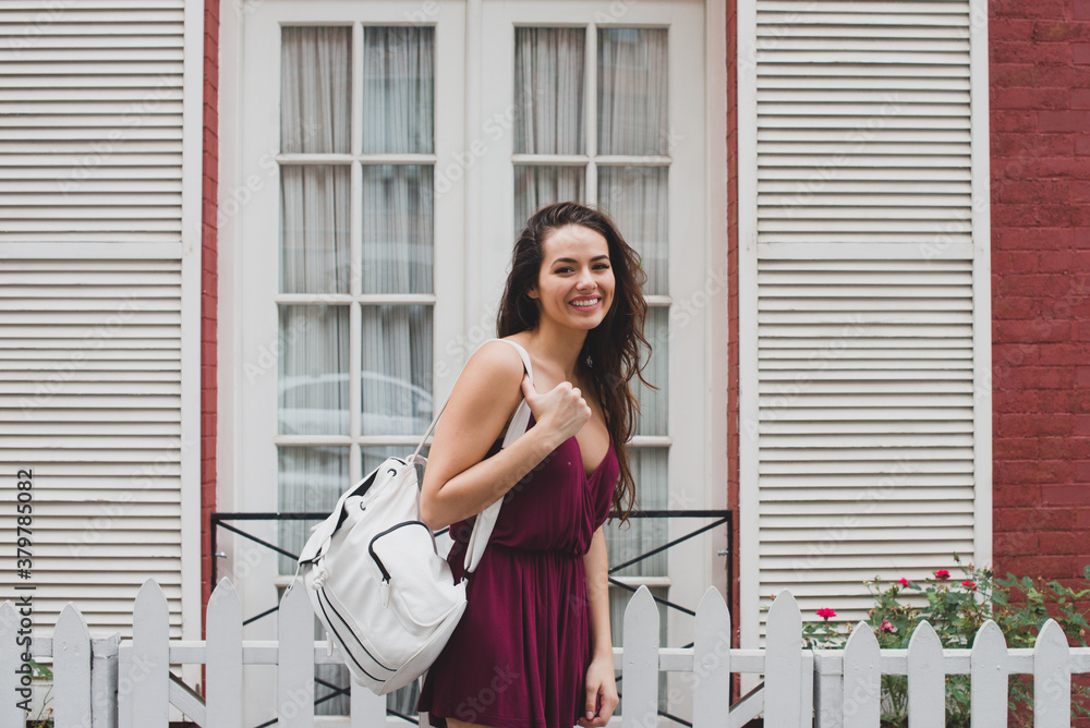 Happy young woman wearing backpack Happy young woman wearing backpack