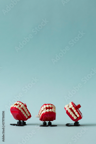 La la la: three vampire teeth toy singing together photo
