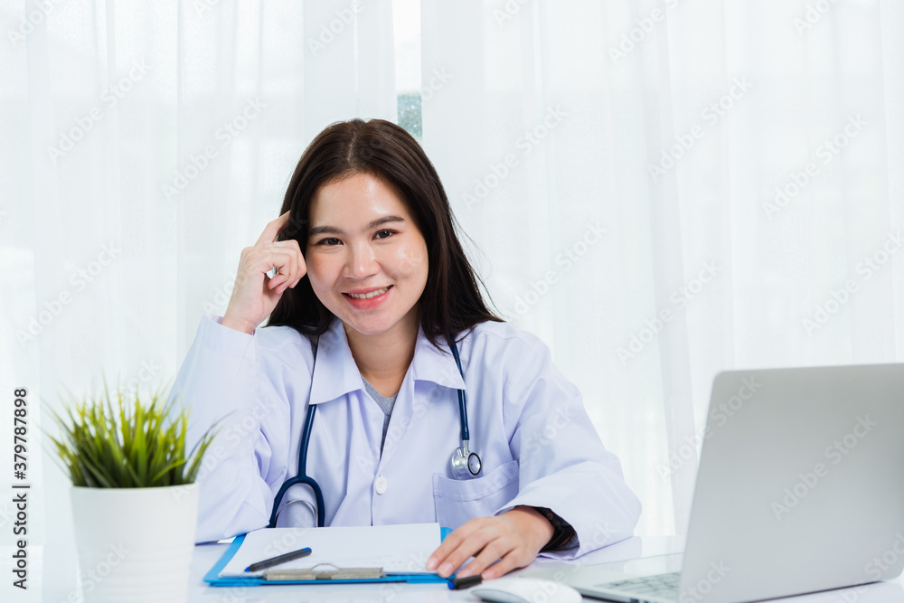 Doctor woman writing something on paperwork or clipboard white paper Doctor woman writing something on paperwork or clipboard white paper