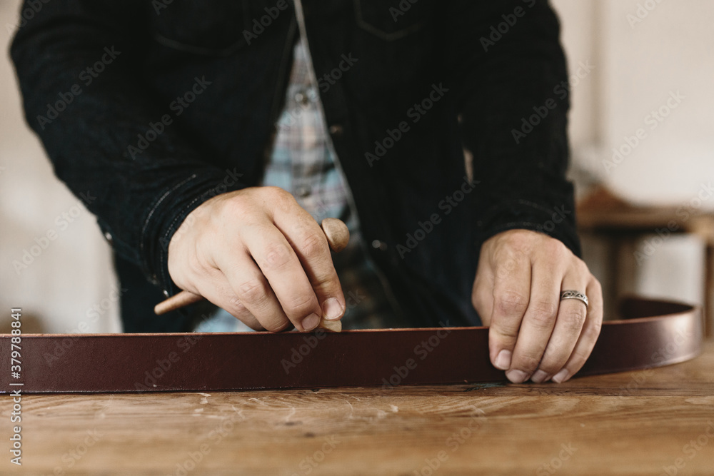 detail of belt being made on table detail of belt being made on table