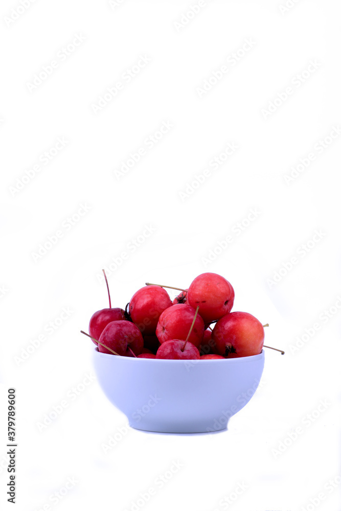 white bowl of apples isolated on white background vertical image white bowl of apples isolated on white background vertical image