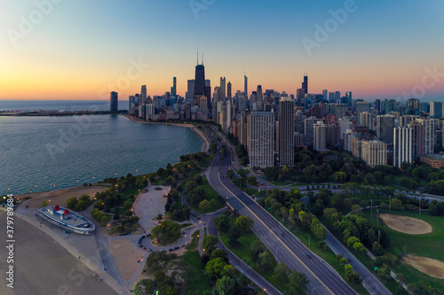 Chicago skyline at twilight. Road leading to the city by the Lake Michigan © marchello74