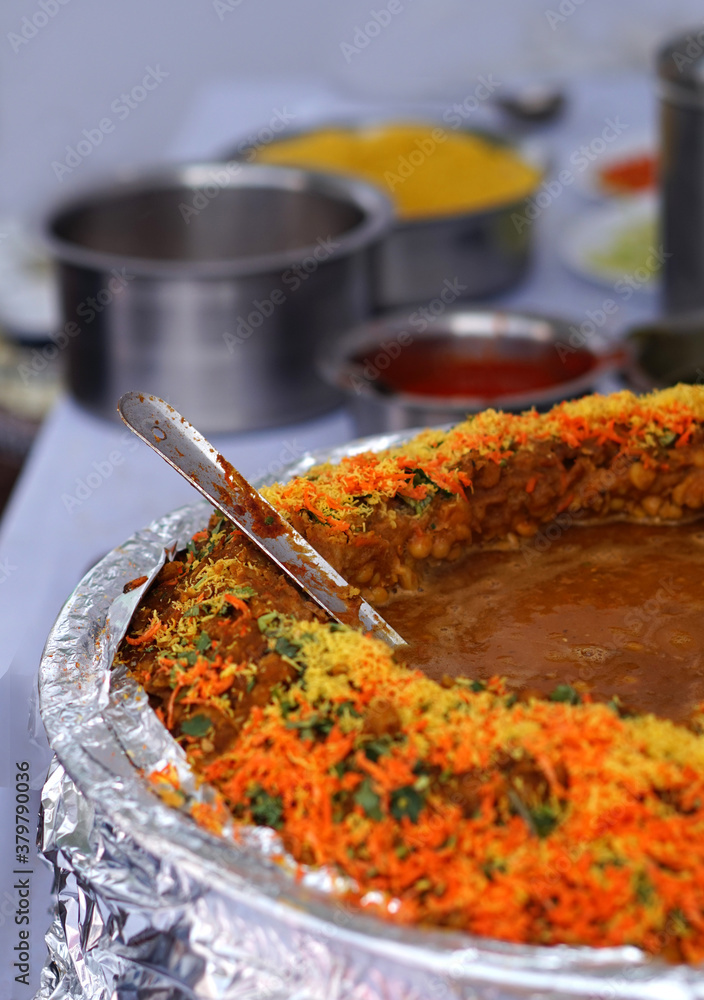 Φωτογραφία Closeup of ingredients of  Indian street food vendor setup for making masala cha