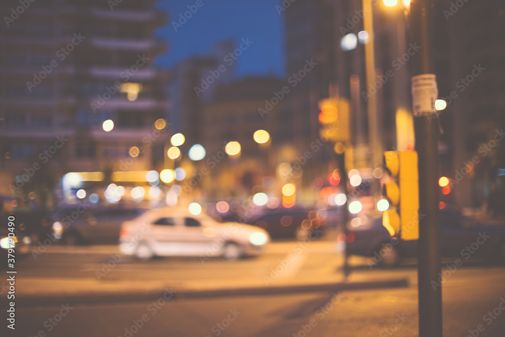 Urban abstract scene, a traffic light with traffic behind, at night. Urban abstract scene, a traffic light with traffic behind, at night.