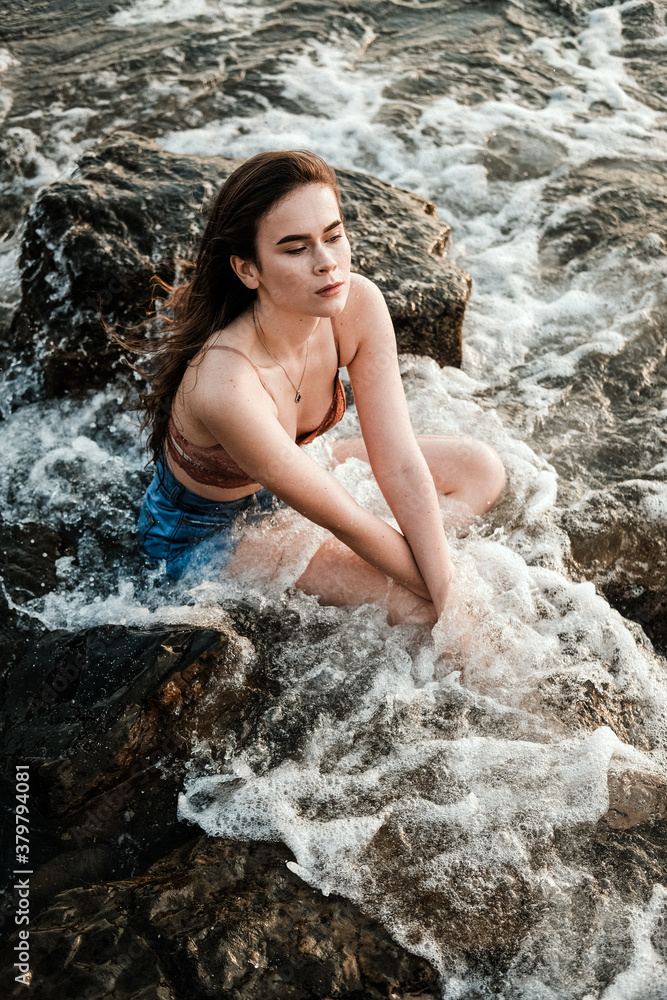 young girl in lingerie on the beach in the water young girl in lingerie on the beach in the water