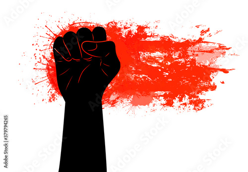 Black silhouette of a fist on a red grunge trace with scratches and watercolor splashes. Demonstrations, manifestos and parades. Freedom for people. Vector object for posters, banners and your design