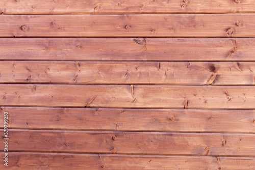  Wooden background. Wooden planks, lining, boards for construction works in the sawmill.