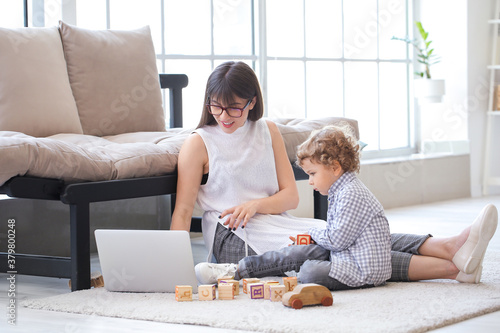 Working mother with little ...