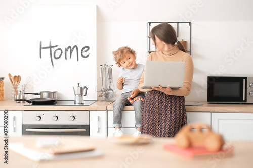 Working mother with little ...