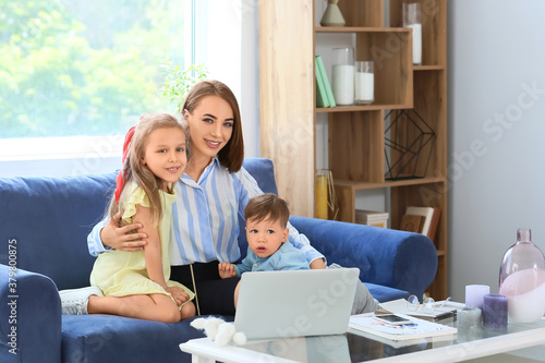 Working mother with little ...