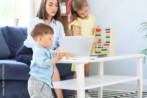 Working mother with little ...