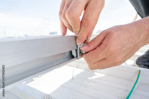 installing metal sheet bar frame and grounding system by barehanded stock photo photo