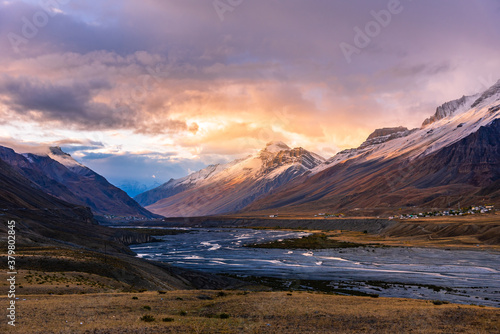 Serene Landscape of Spiti river valley & snow capped mountains during sunrise Kee or key monastery near Kaza town in Lahaul & Spiti district of Himachal Pradesh, India.