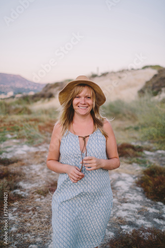 Beautiful woman in mountains of sea coast