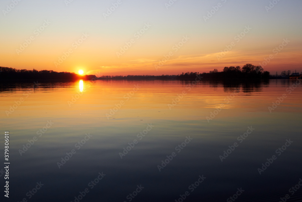 Sunset over the river during the cold season