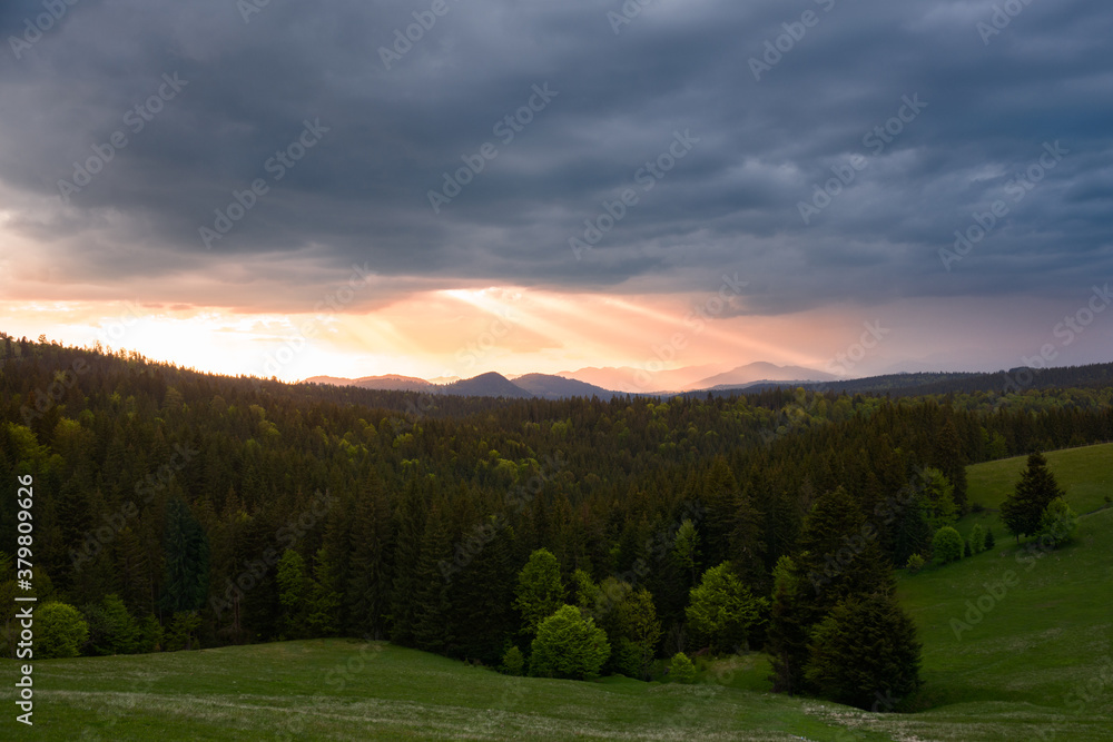 Sun rays between storm clouds Sun rays between storm clouds