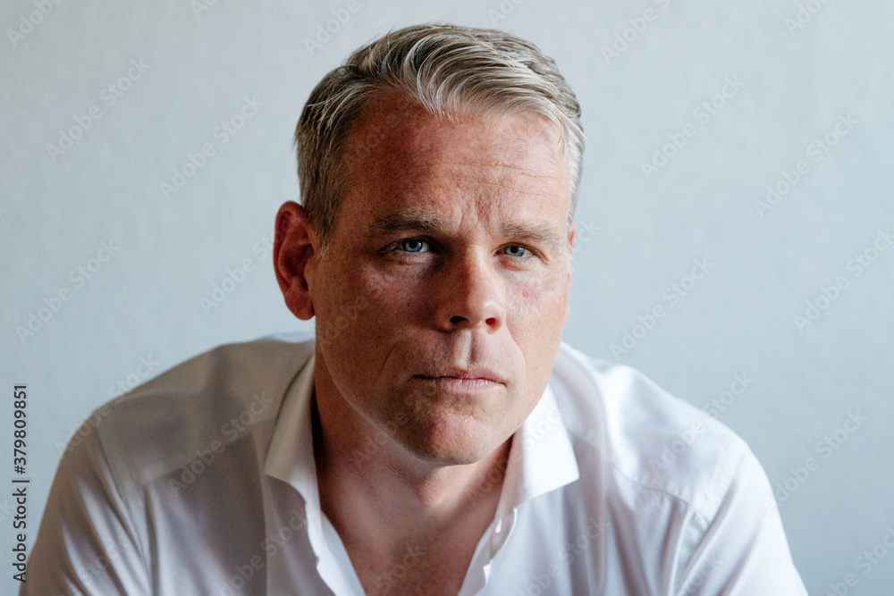 Portrait of middle aged male wearing business casual indoors Portrait of middle aged male wearing business casual indoors