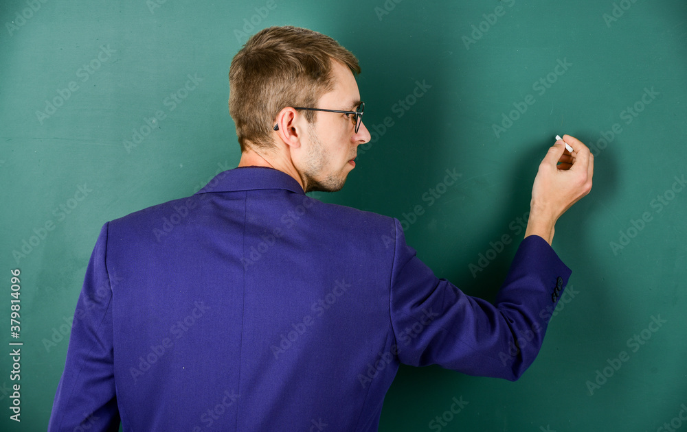 back to school. university teacher write on blackboard. student study in college. modern education concept. young but skilled businessman. typical office worker. man wear glasses and jacket back to school. university teacher write on blackboard. student study in college. modern education concept. young but skilled businessman. typical office worker. man wear glasses and jacket