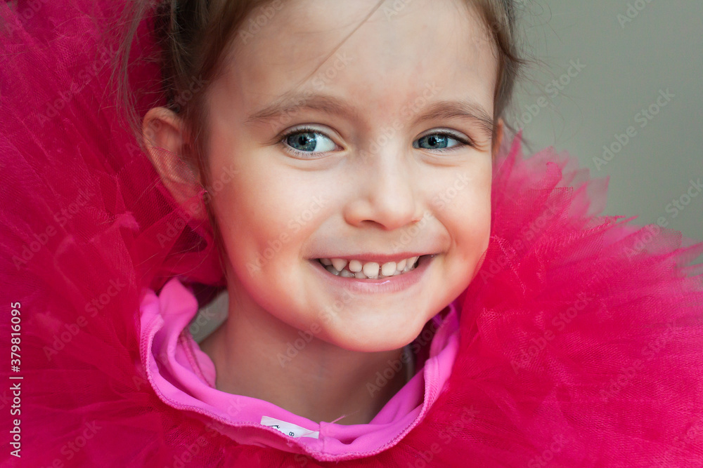 Portrait of a Little Girl in a funny ballet skirt dressed around the neck