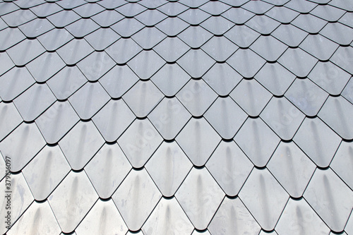 Close up detail of diamond shape lead roof tiles