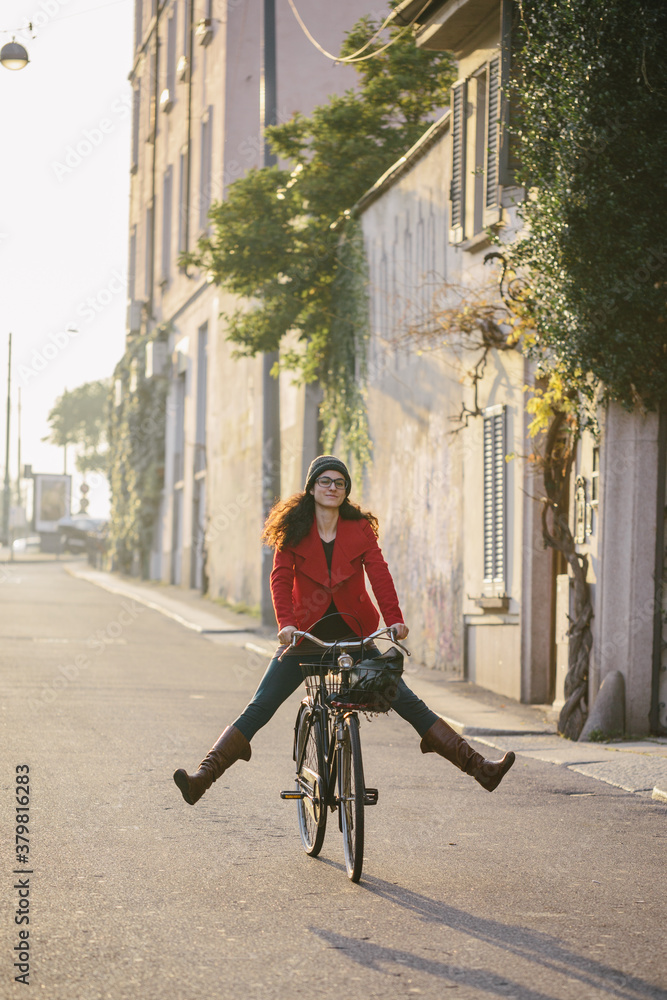 Young woman having fun with bicycle Young woman having fun with bicycle