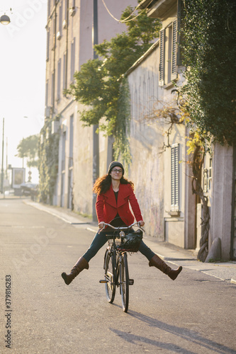 Wallpaper Mural Young woman having fun with bicycle Torontodigital.ca