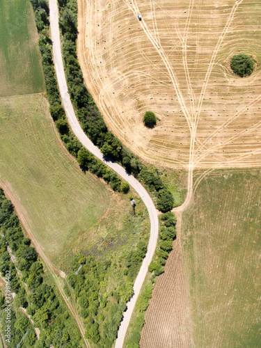 Aerial view of road cutting through farmfields photo